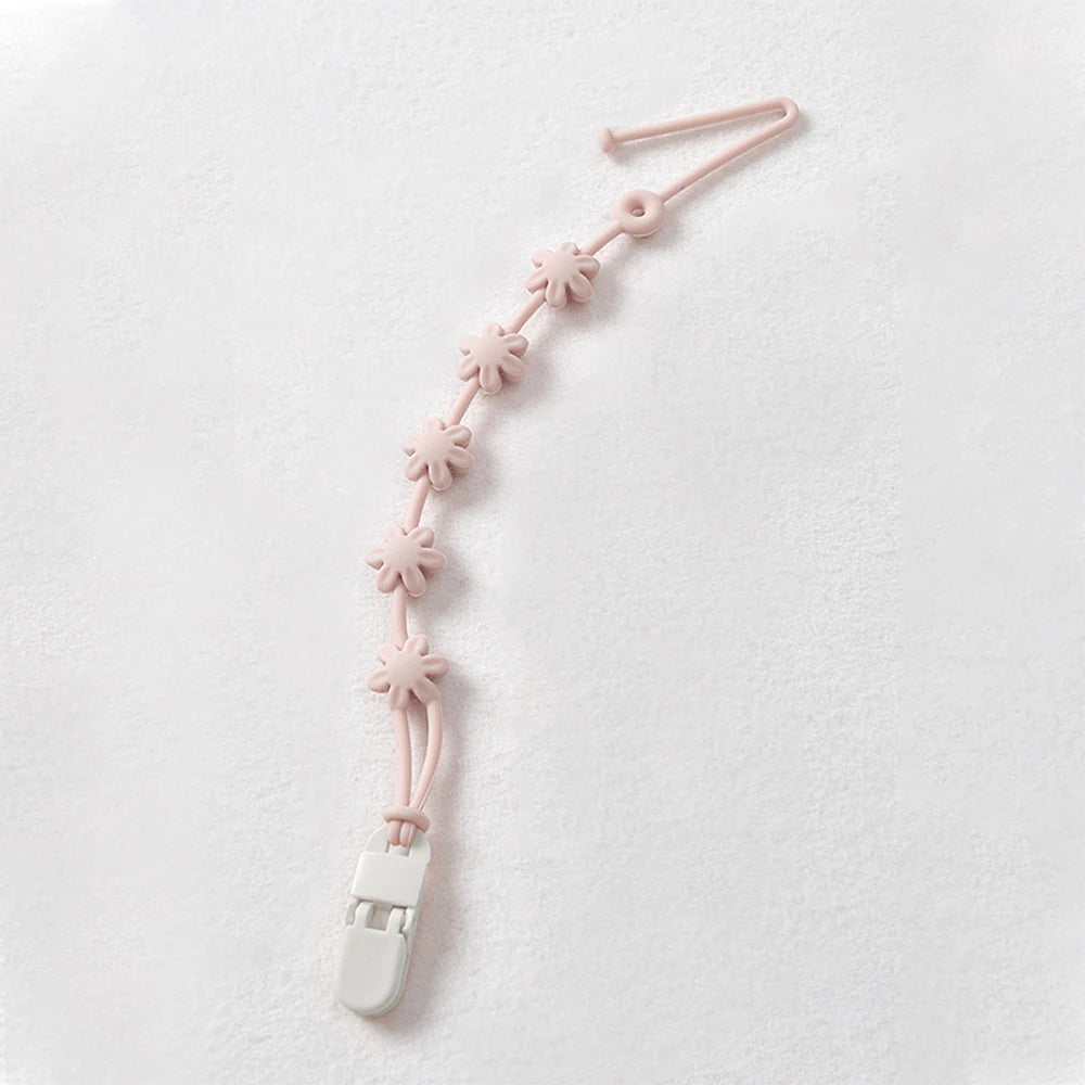 Soft Teething Pacifier Clip hanging on stroller