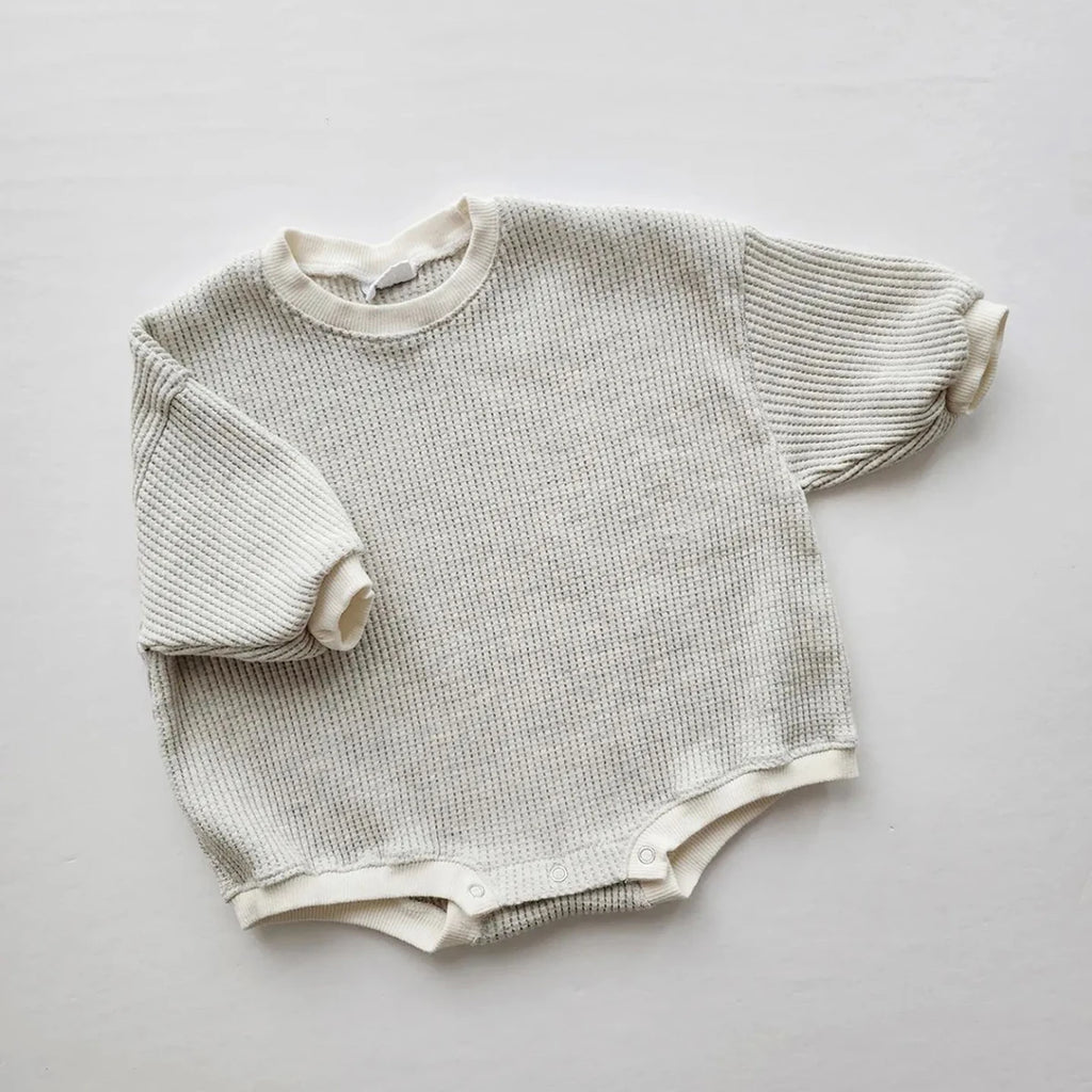 Close-up of Waffle Cotton Fabric Texture on Baby Romper Sweatshirt