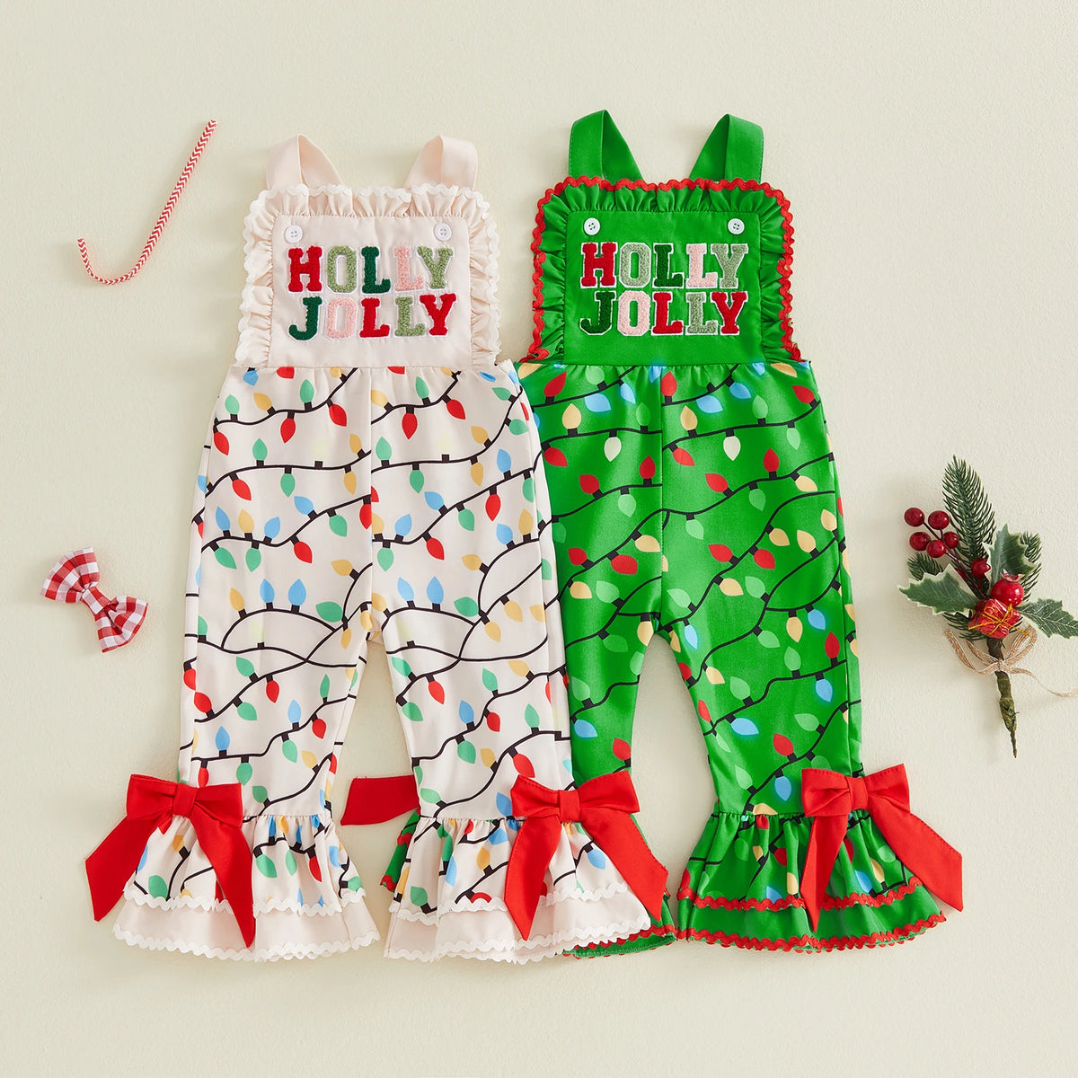 Cream and green Holly Jolly overalls with colorful Christmas light prints, ruffled bibs and hems, and red bows.
