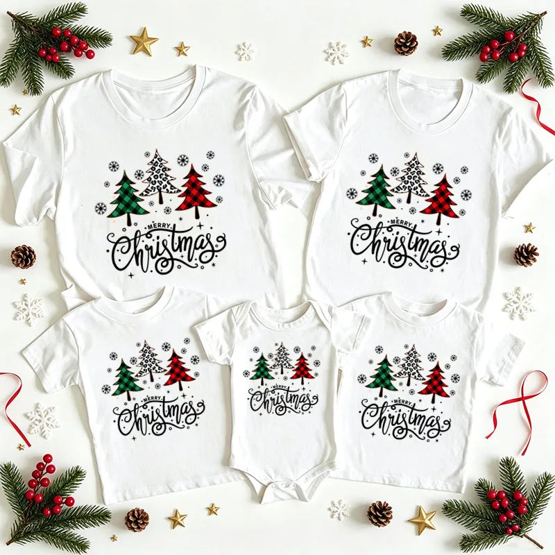 White adult and child T-shirts and a baby bodysuit with three patterned Christmas trees and Merry Christmas lettering.