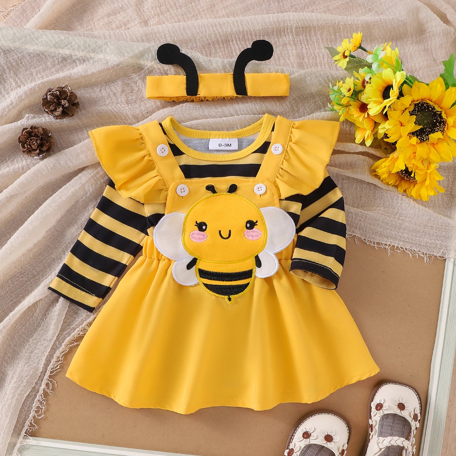 Yellow bee baby girls costume set with striped romper, yellow suspender dress with bee applique, and yellow headband with bee