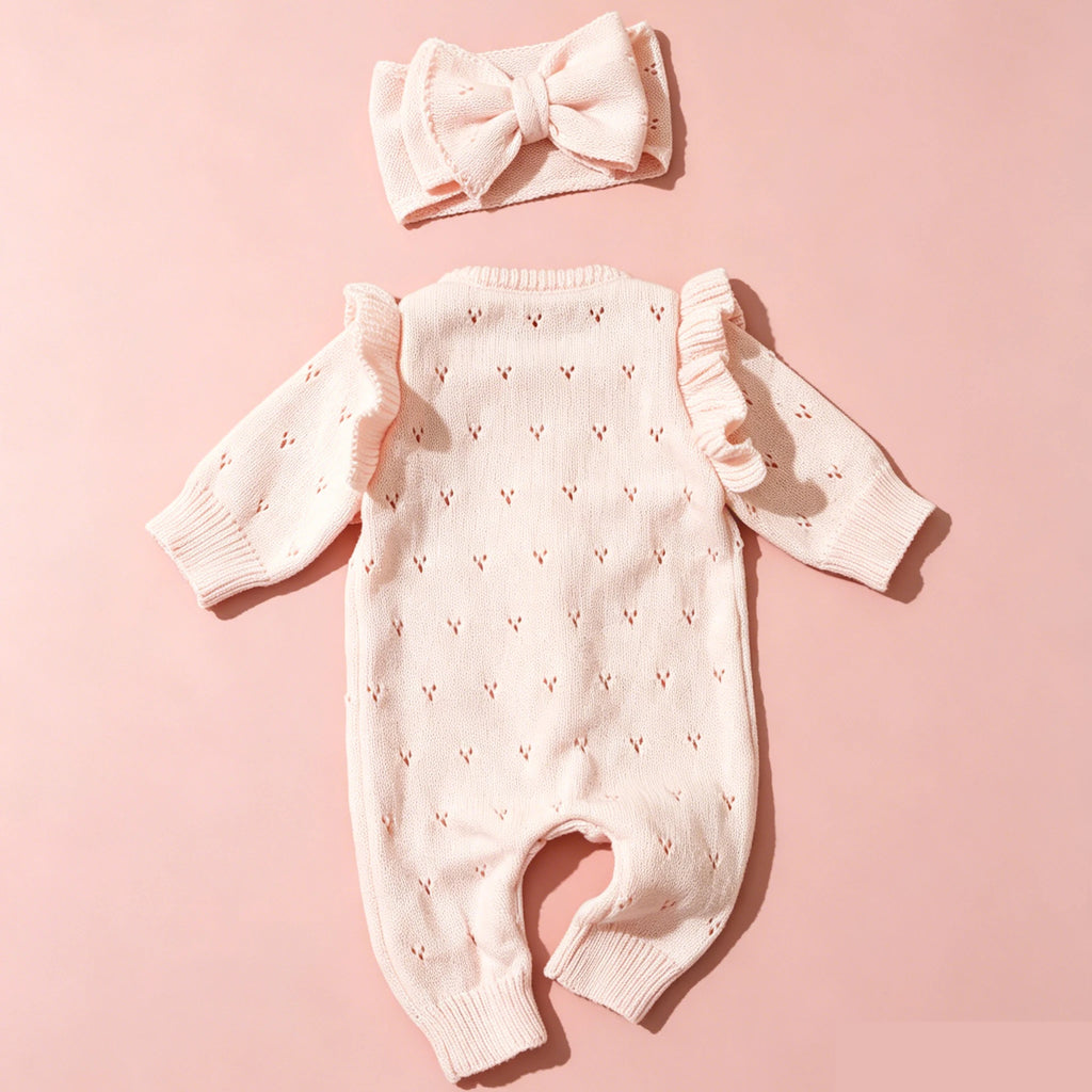 Pink Knit Romper Set Displayed with Matching Bow Headband