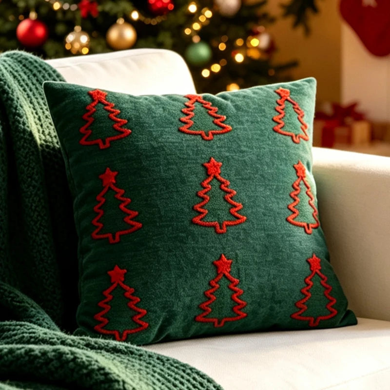 Christmas pillow cover featuring red Christmas tree outlines on a green background.