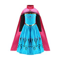 Blue dress with floral patterns and gold trim paired with a pink cape featuring a high collar and jewel detail