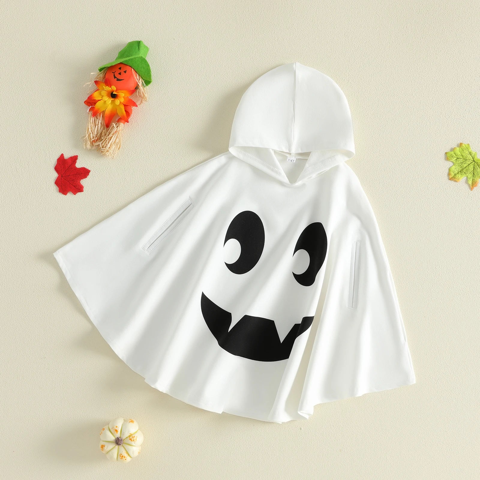 Ghost hooded cape costume styled with fall decorations