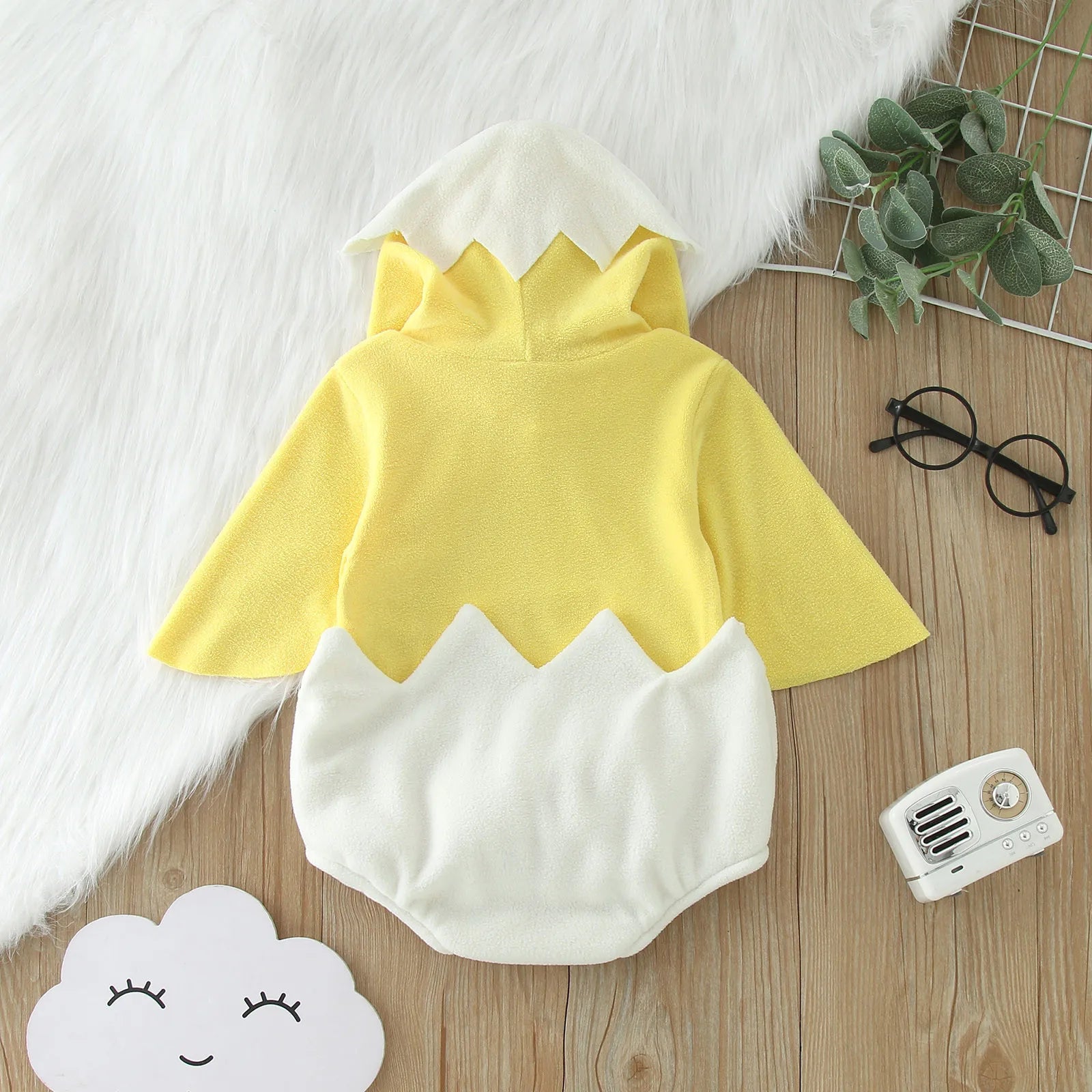 Close-up of snap closures inside white eggshell part of chick costume romper