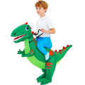 Child wearing inflatable green dinosaur ride-on costume with blue pants and white shoes