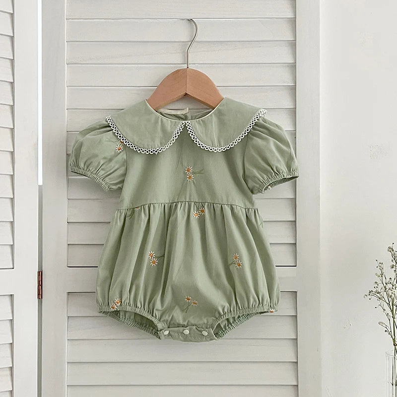 Close-up of Embroidered Flowers on Baby Dress