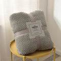 Soft fleece baby blanket on nursery crib
