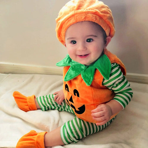 Baby wearing an orange pumpkin romper costume set with green leaf collar, matching pumpkin hat, and orange booties