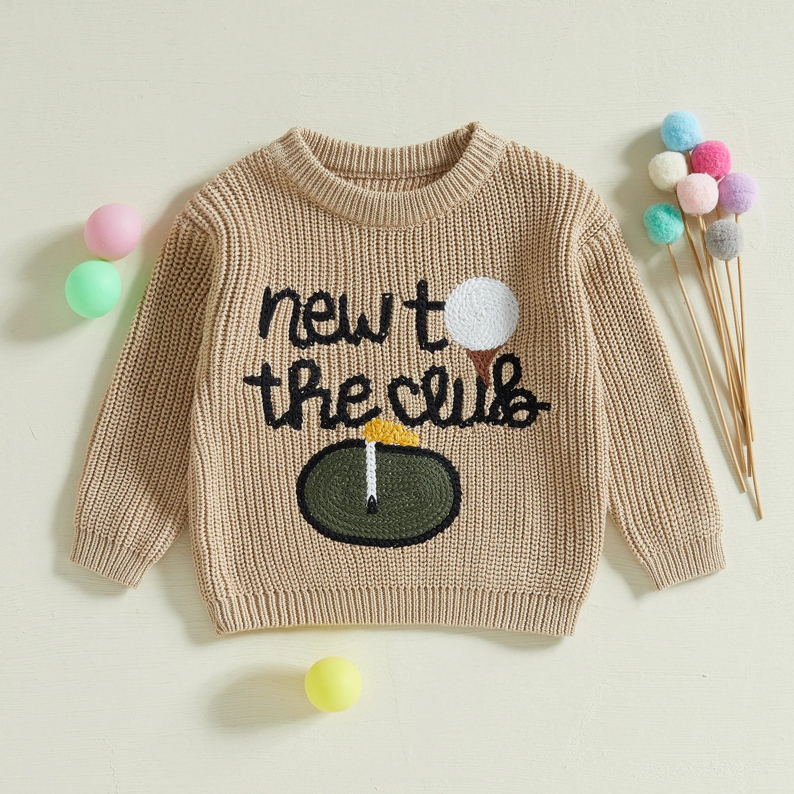 Close-up of Golf Letter Embroidery on Baby Sweater