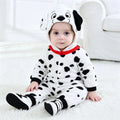Infant wearing a dalmatian dog jumpsuit costume with hood featuring dog face and ears, white with black spots and red collar