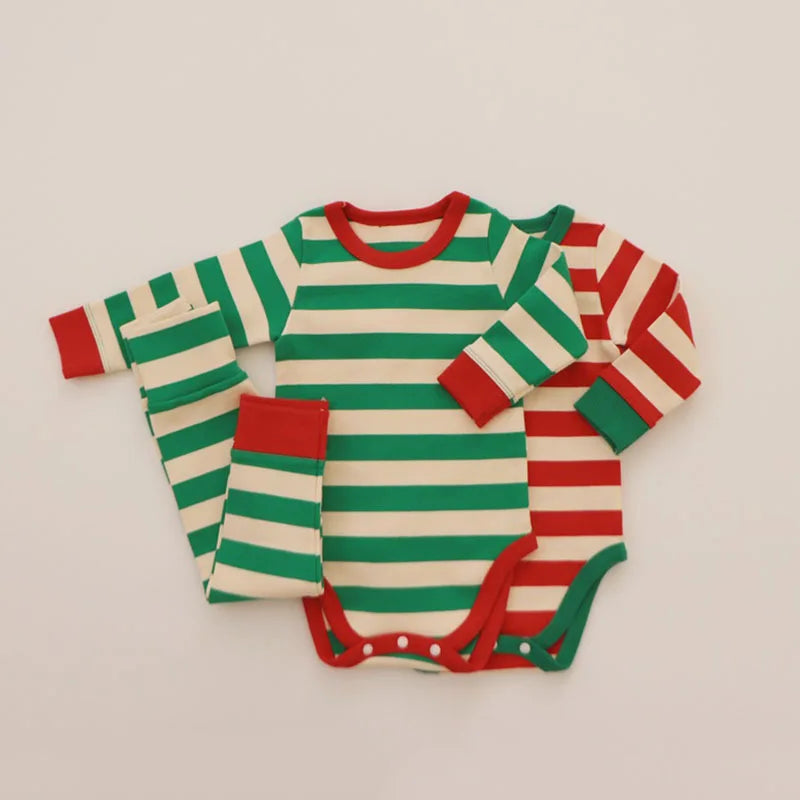 Green-and-cream and red-and-cream striped baby bodysuits with contrasting cuffs and coordinating striped pants.