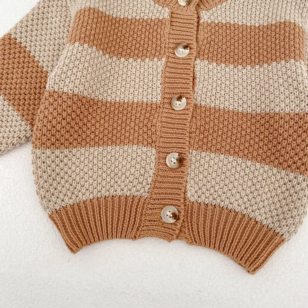 Baby wearing striped knitted cardigan sweater jacket in khaki color