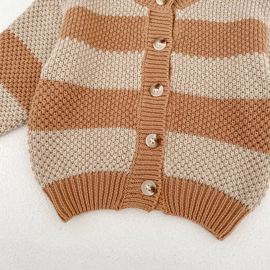 Baby wearing striped knitted cardigan sweater jacket in khaki color