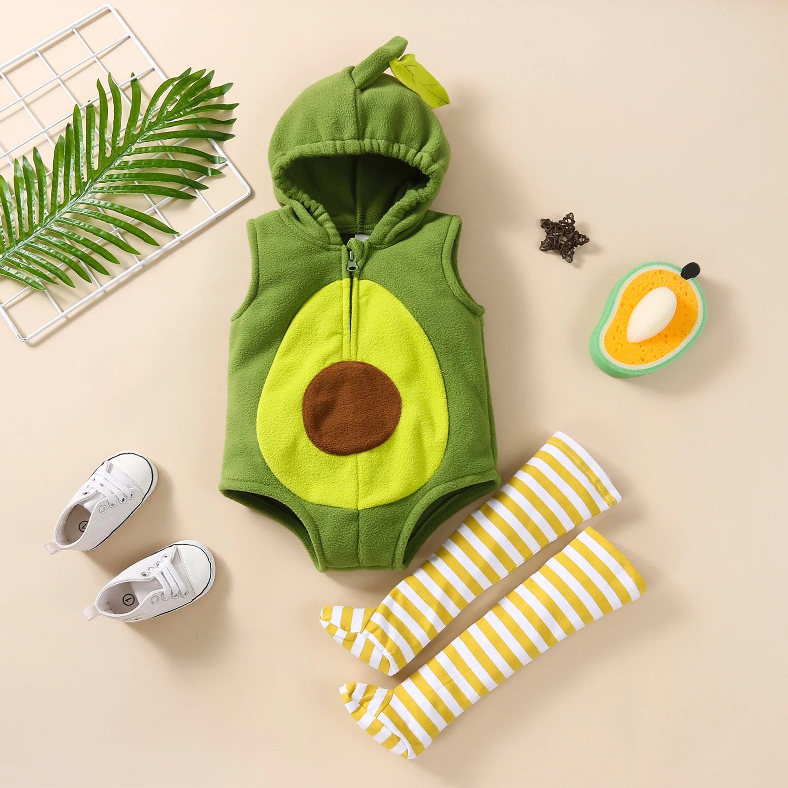 Avocado romper costume laid flat with striped stockings