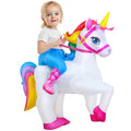 Child wearing inflatable unicorn costume with white body, yellow horn, pink harness, and multicolored mane and tail