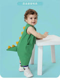 Baby wearing green dinosaur tail romper costume
