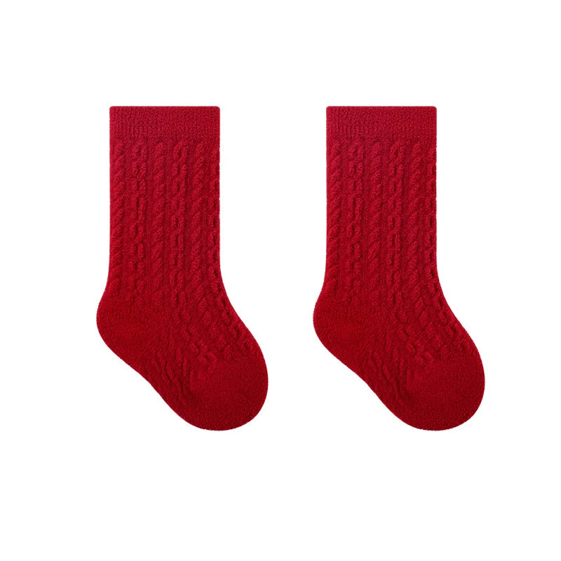 Cranberry red socks with a textured cable-knit pattern.