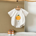 Apricot Fruit Patch Bubble Romper displayed on hanger