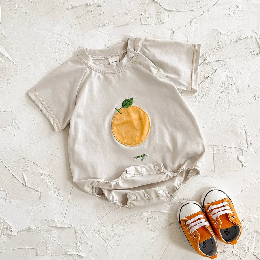 Apricot Fruit Patch Bubble Romper flat lay with orange patch