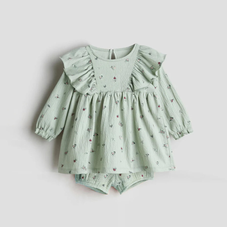 Toddler girl outfit featuring organic cotton long sleeve top and shorts