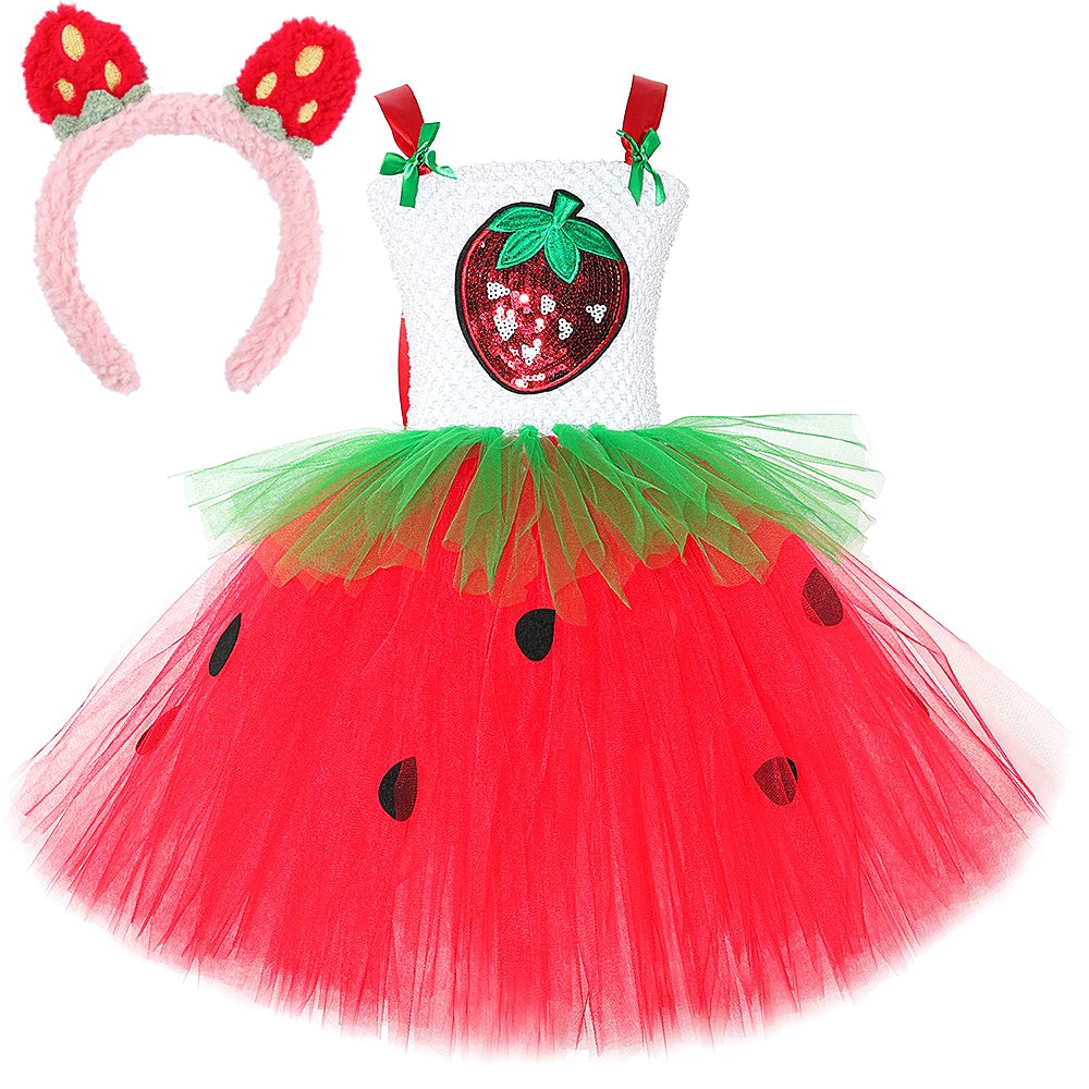 Full view of red tulle tutu skirt with black seed appliques and green tulle overlay at waist on strawberry dress