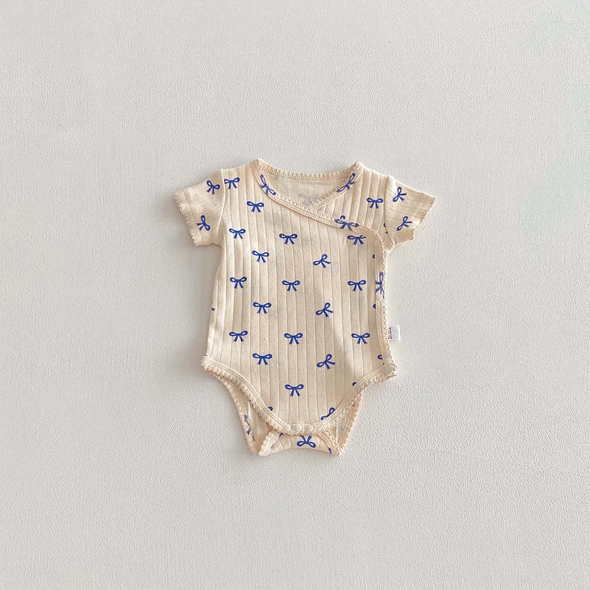 Printed Short-Sleeved Baby Bodysuit on baby model