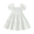 White smocked puff-sleeve dress on white background