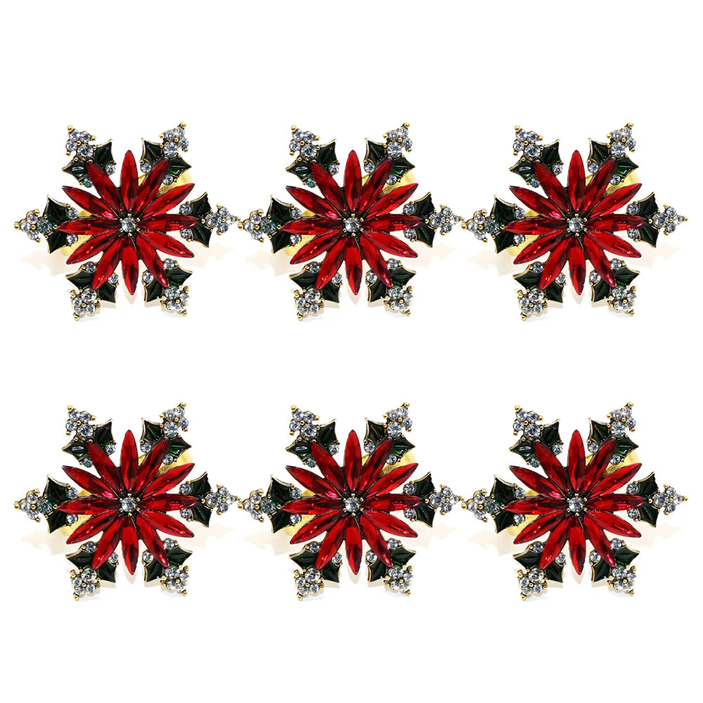 Red Poinsettia Snowflake Napkin Rings — Set of 6. A red poinsettia framed by green leaves and clear accents.
