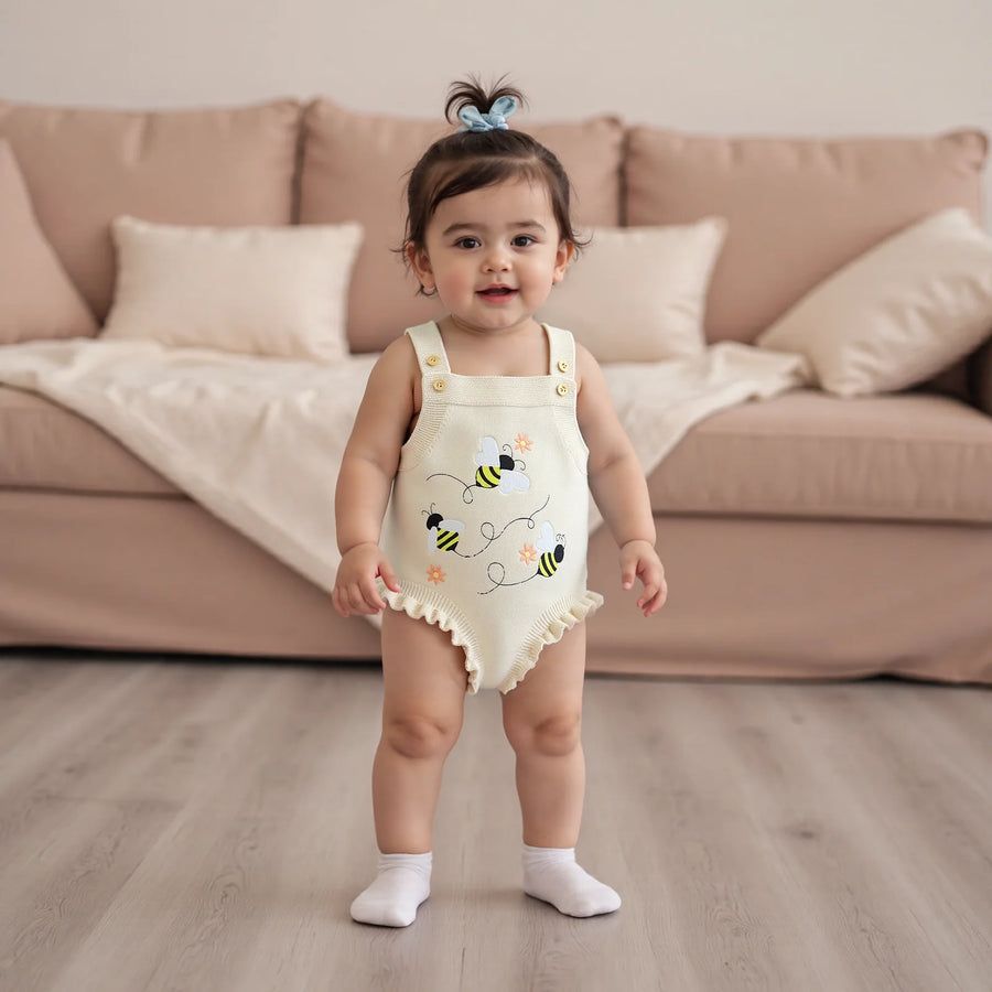 Floral Bee Knit Sweater Romper hanging display