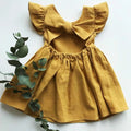 Mustard cotton-linen ruffle-back dress flat lay