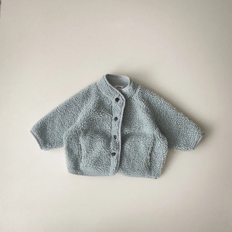 Close-up of lamb wool fabric on children's winter coat