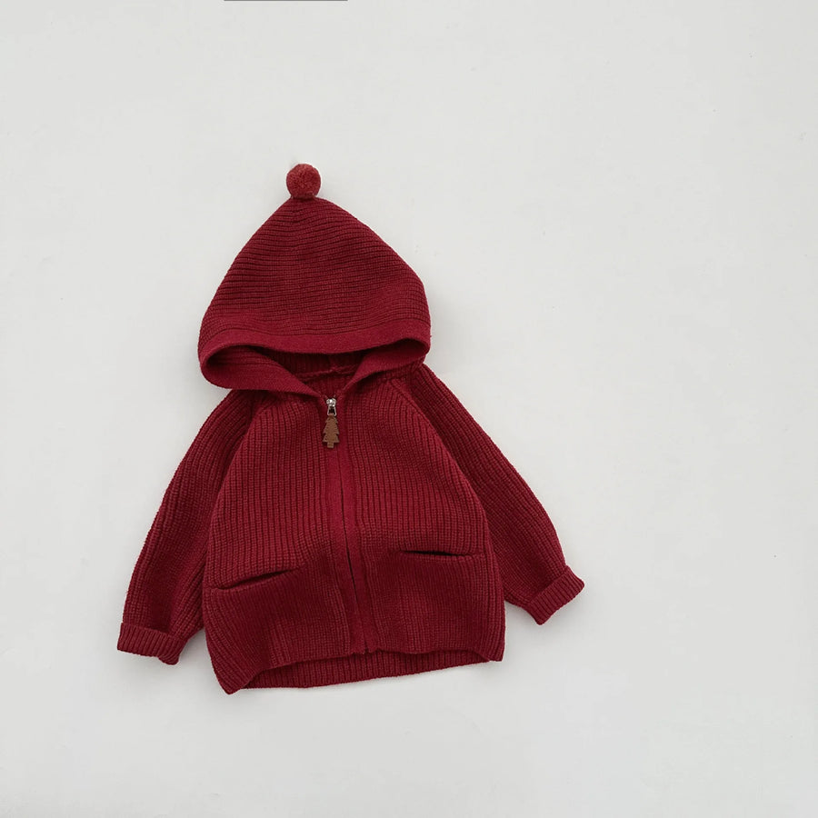 Close-up of knit texture on baby hooded coat