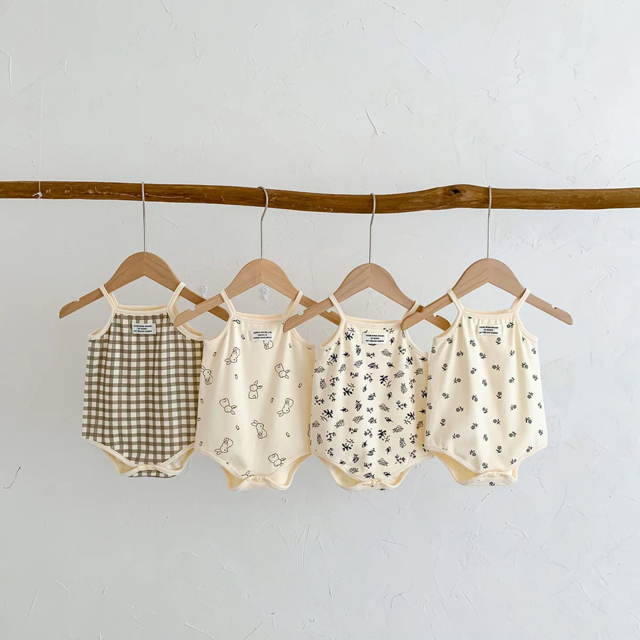 Sleeveless triangle bodysuit for baby with sling design in various patterns
