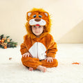Child wearing a brown lion hooded animal romper costume sitting on white carpet