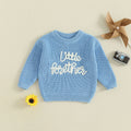 Close-up of letter embroidery on baby boy autumn winter knit sweater