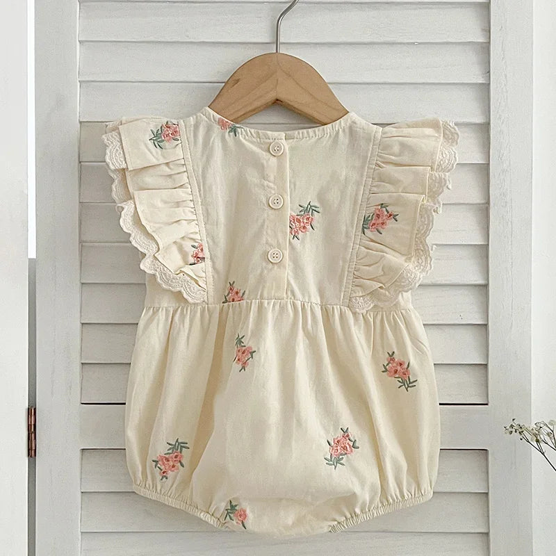 Side view of baby girl sleeveless cotton bodysuit with floral design