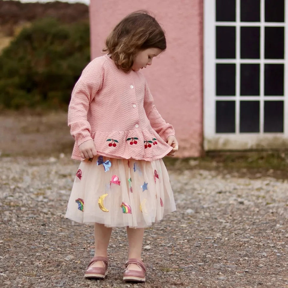 Close-up of mesh and sequin details on girls' princess dress