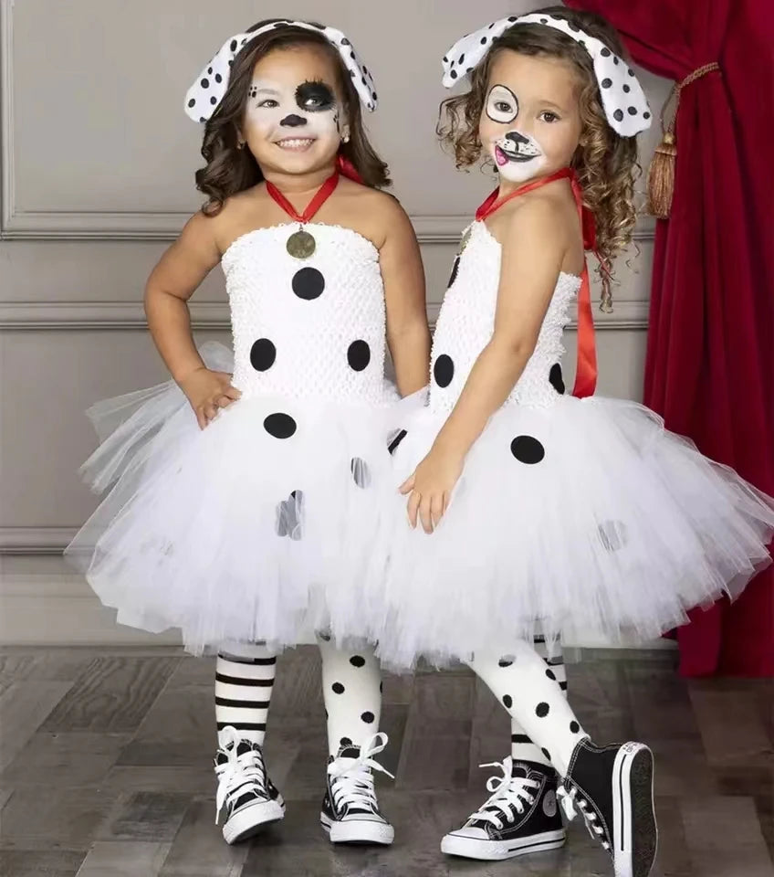 Child wearing white Dalmatian dog tutu dress costume with spotted leggings and dog ear headband