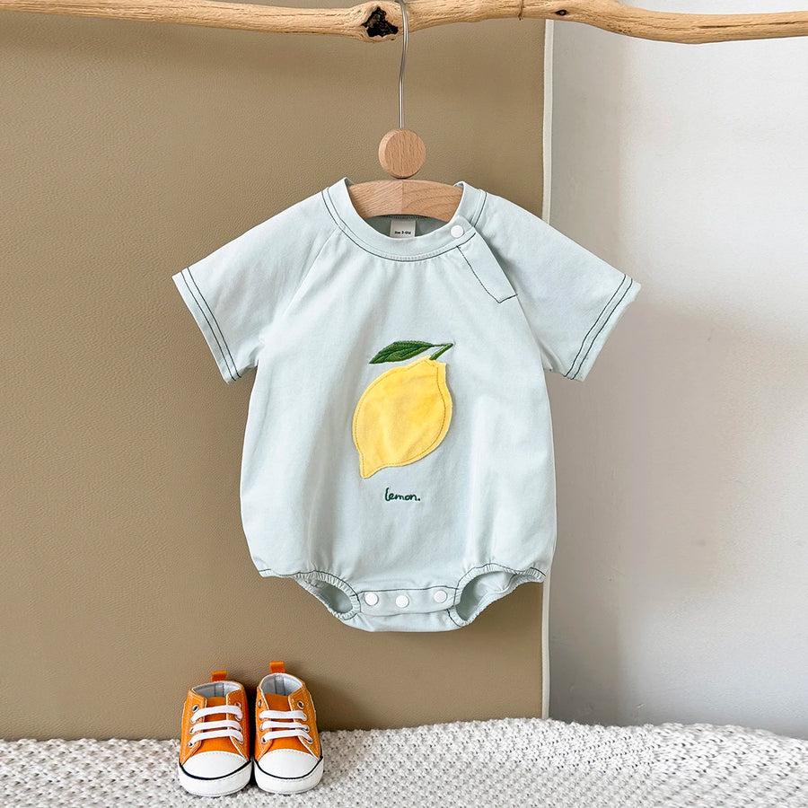 Pale green Fruit Patch Bubble Romper displayed on hanger