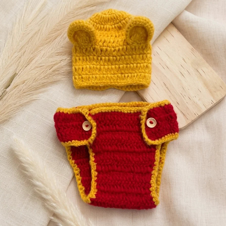 Yellow crochet bear hat and red diaper cover with yellow trim