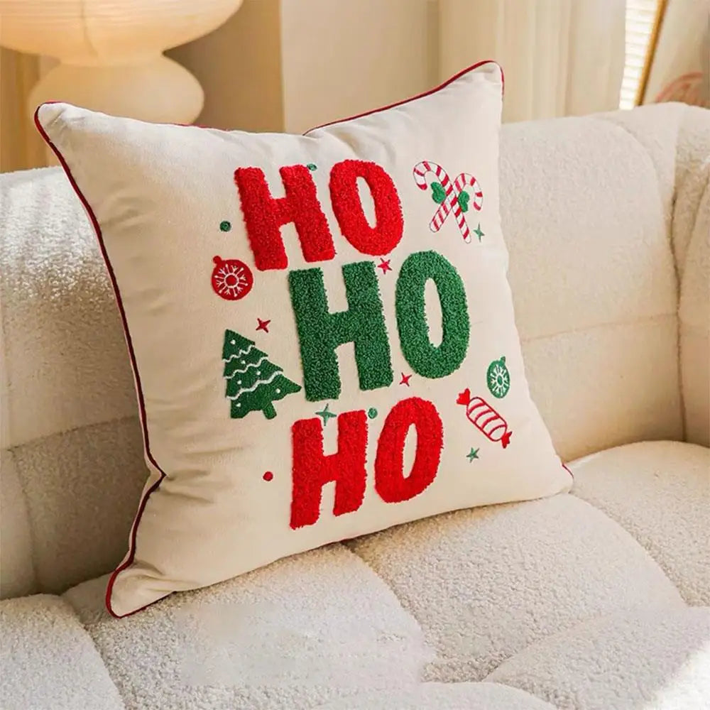 Christmas ho ho ho pillow cover, style 1, featuring red and green HO HO HO lettering, candy canes, and a Christmas tree.