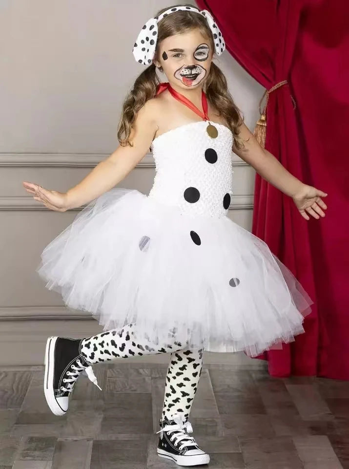 Child wearing white Dalmatian dog tutu dress costume with spotted leggings and dog ear headband