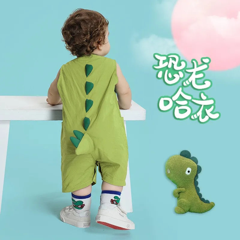 Baby standing in light green dinosaur tail romper costume