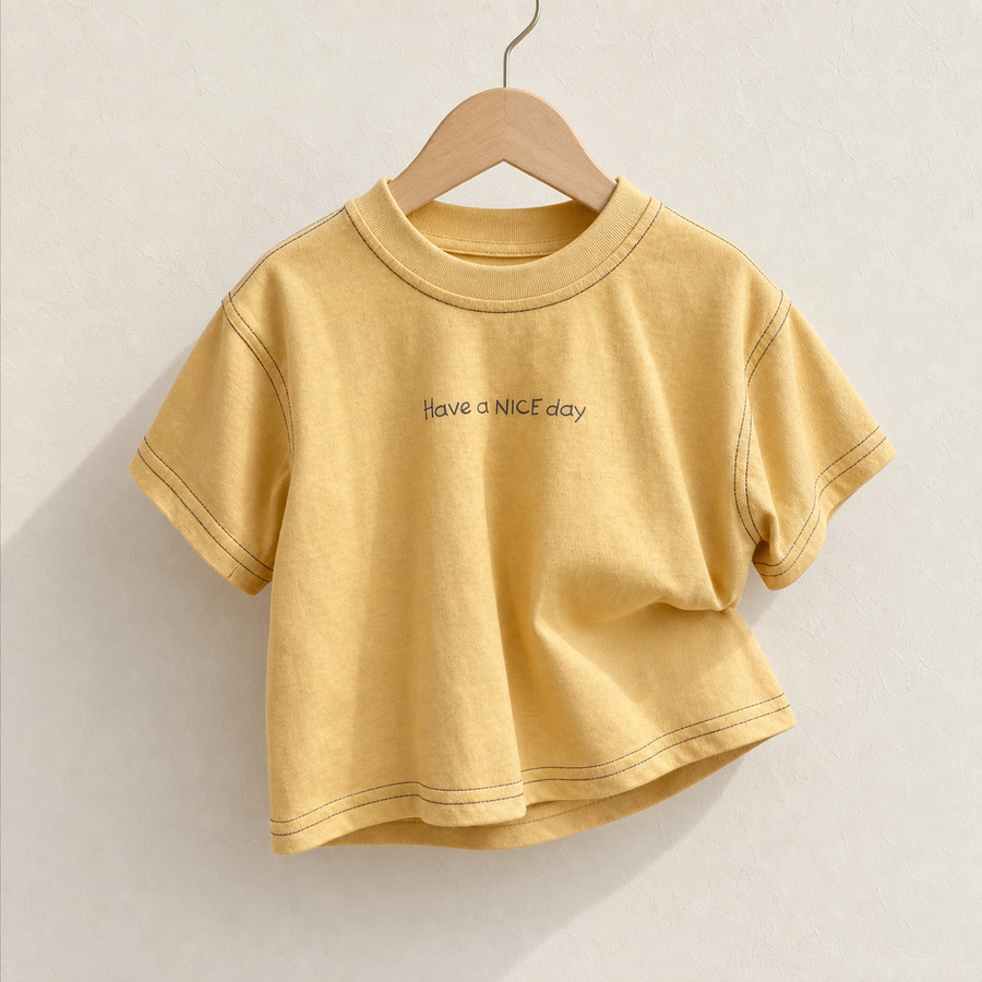 Yellow Have a Nice Day Short Sleeve Tee on a wood hanger