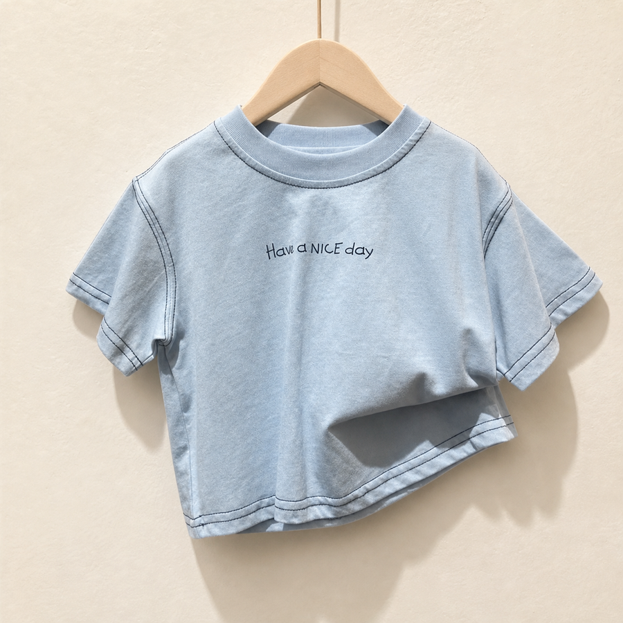 Blue Have a Nice Day Short Sleeve Tee on a wood hanger