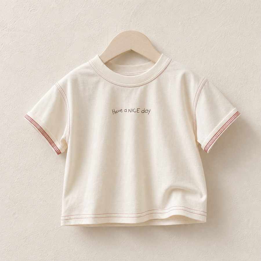 Apricot Have a Nice Day Short Sleeve Tee on a wood hanger