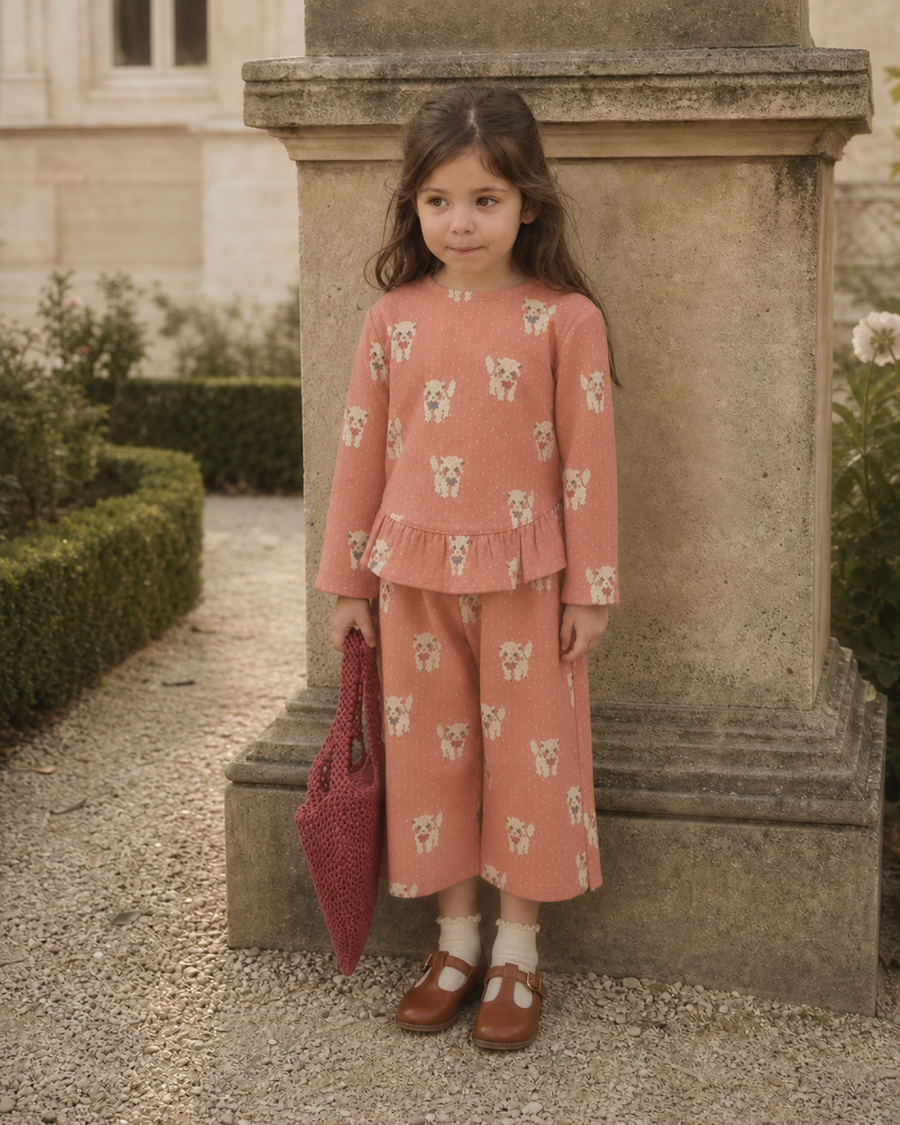 Girl wearing the lightweight Jardin de Soleil Margot Pants in a French garden